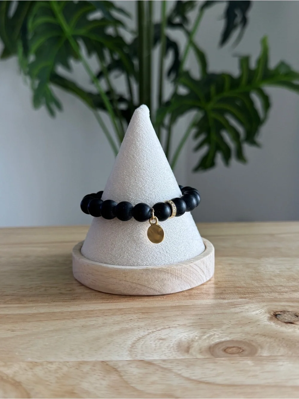 Matte Black Beaded Stretch Bracelet with Gold Charm